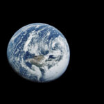 Earth as seen from Apollo 10 mission in 1969, showcasing its spherical shape and cloud cover