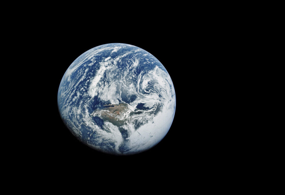 Earth as seen from Apollo 10 mission in 1969, showcasing its spherical shape and cloud cover