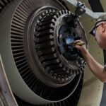 American Airlines aircraft engine undergoing maintenance. Efficient engine upkeep is crucial for airlines operating flights to Europe.