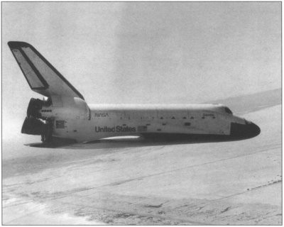 Photo from chase plane of Columbia landing on Rogers Drylake Runway 23.