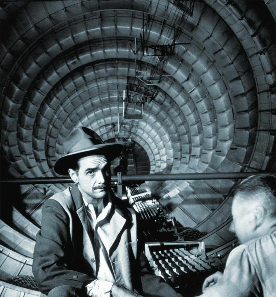 Howard Hughes inside the H-4 Hercules, showcasing the cavernous interior intended for cargo and troops.
