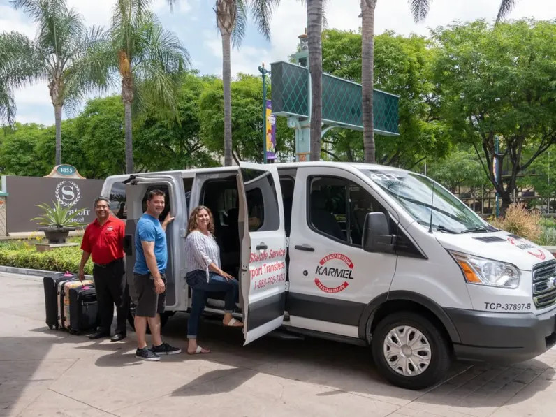 Karmel Shuttle van, a shared ride service offering airport transportation to Disneyland area hotels, a cost-effective option for smaller groups.