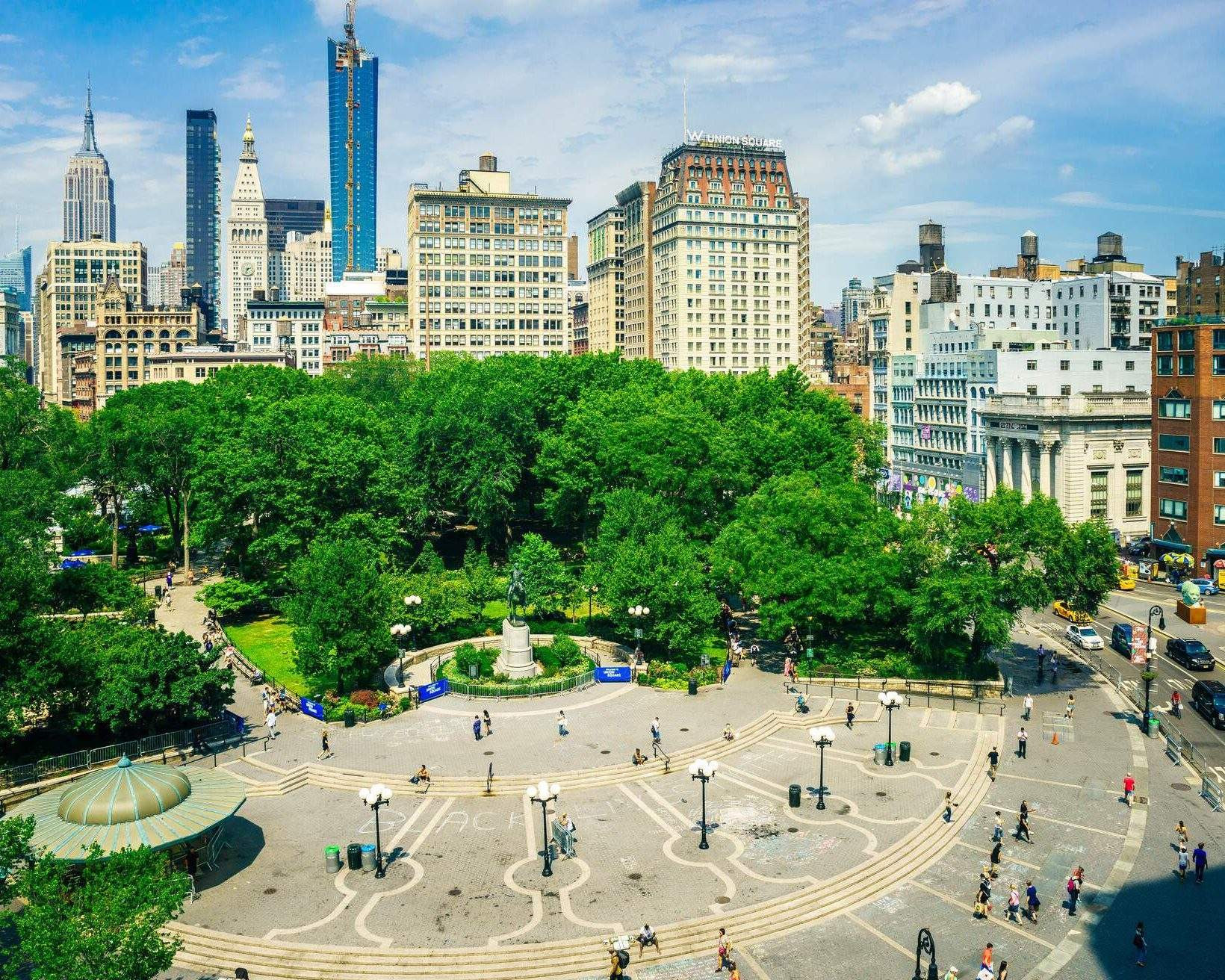 A view of Union Square in New York City, with people and buildings in the background.