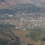 Aerial view of Reno-Tahoe International Airport, showcasing its proximity to the city and surrounding landscape