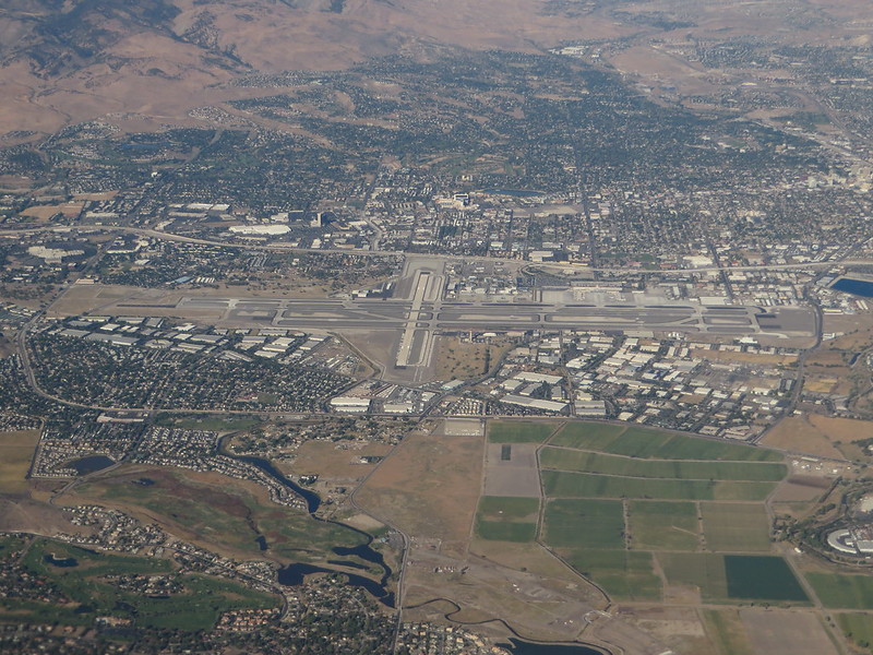 Aerial view of Reno-Tahoe International Airport, showcasing its proximity to the city and surrounding landscape