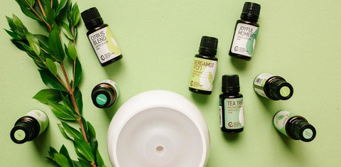 Diffuser emitting mist with essential oils.