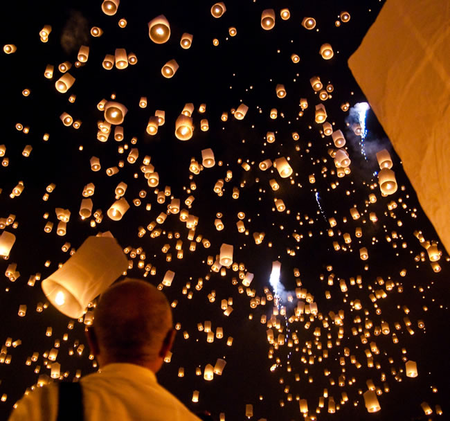 Beautiful sky lanterns illuminating the night sky, created with biodegradable materials, ready to float during a celebration.