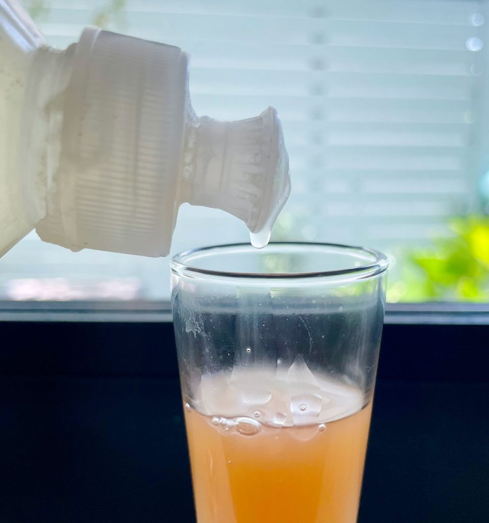 Dish Soap Into Apple Cider Vinegar For DIY Fruit Fly Trap