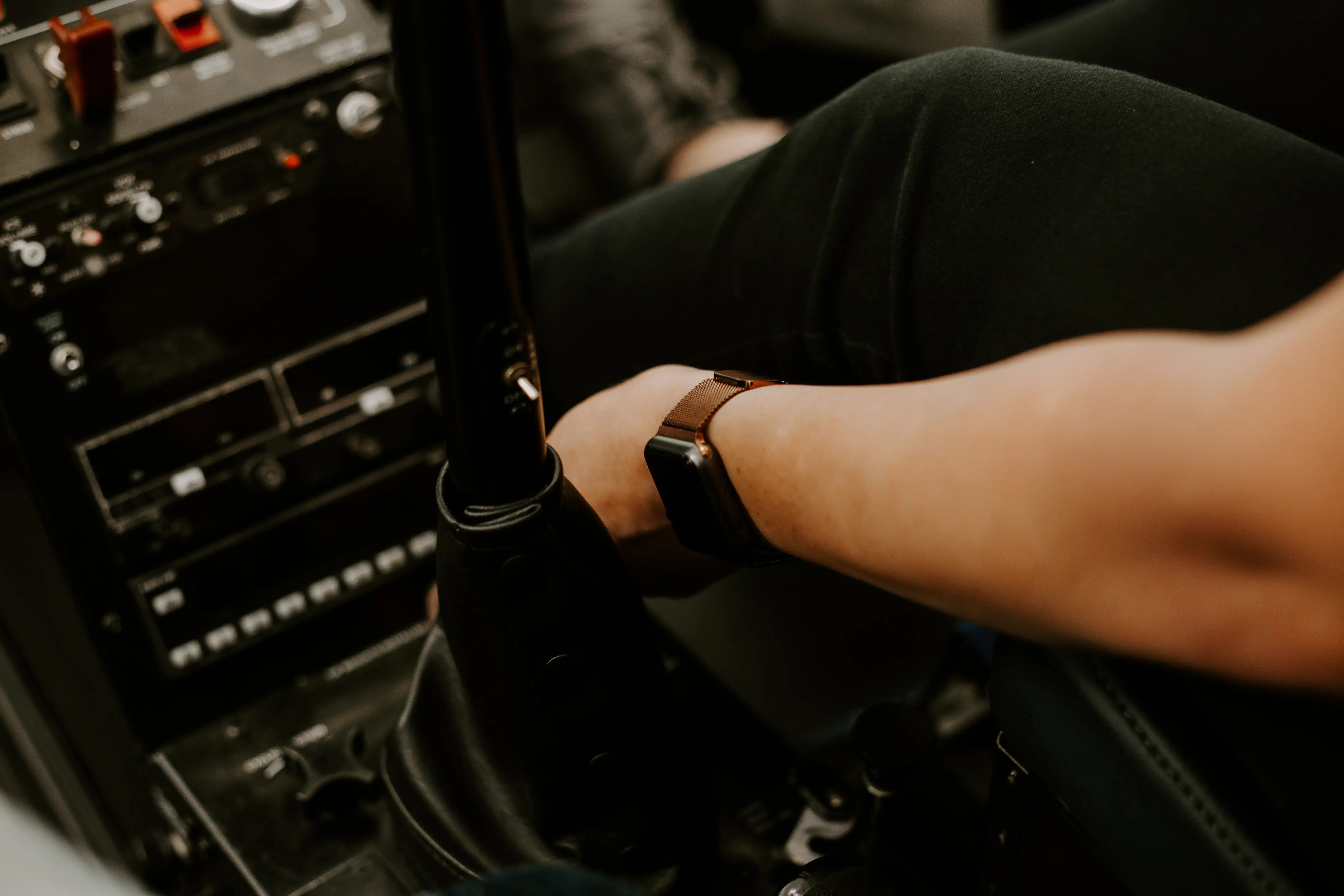 Pilots in a helicopter cockpit, representing the technology and expertise required for helicopter operation and long-distance flights