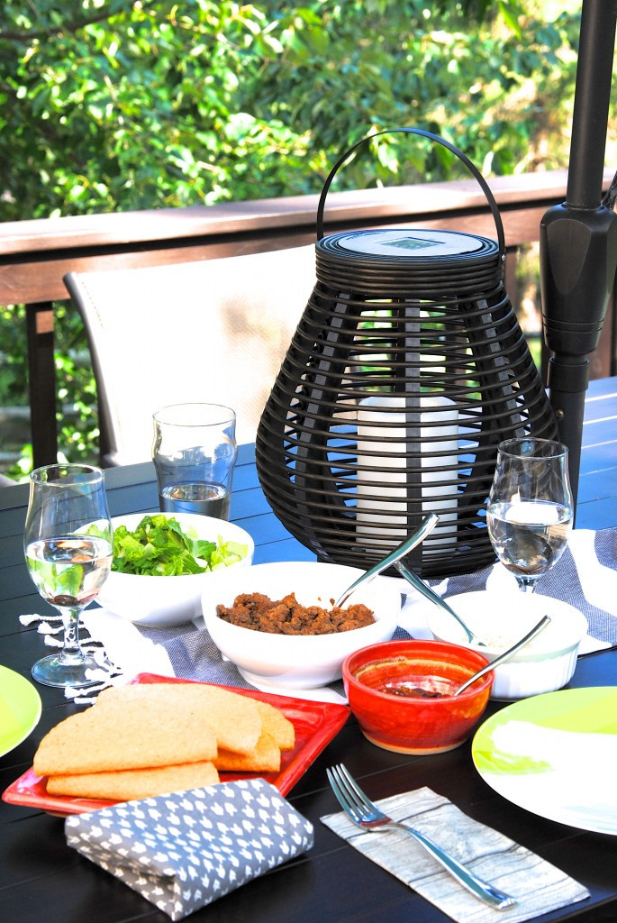 A fly-free picnic table setup using water bags with pennies