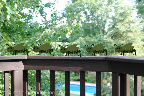 A cartoon representation of flies observing food from a distance, deterred by the penny trick