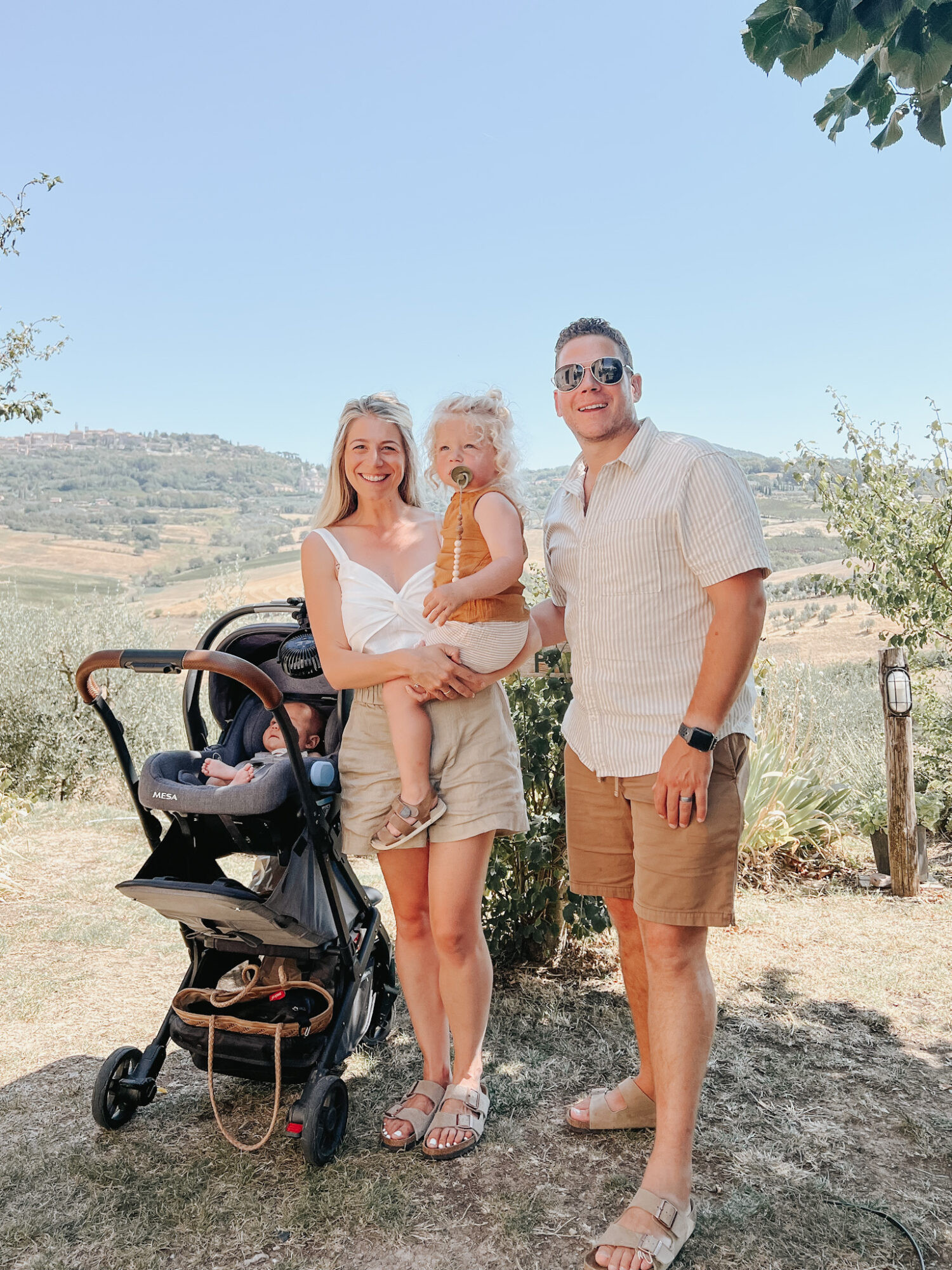 Family portrait during international travel with a newborn baby