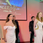 Cast members performing on stage