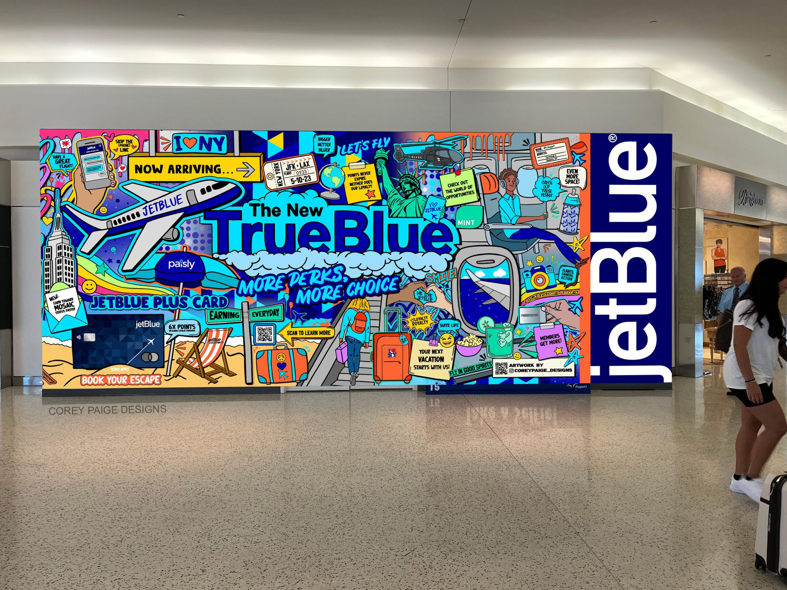 a wall with a picture of a plane and a jet blue sign