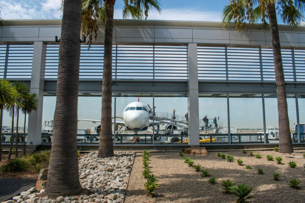 Exterior of Long Beach Airport (LGB), a smaller, less crowded airport option for Disneyland visitors, served by airlines like Southwest and Delta.