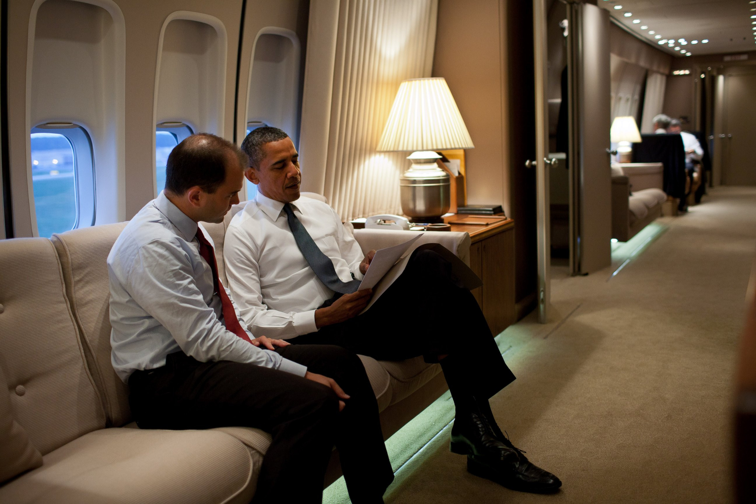 PHOTO: President Barack Obama talks with Ben Rhodes, Deputy National Security Advisor for Strategic Communications, aboard Air Force One en route to New York, N.Y., to commemorate the tenth anniversary of the 9/11 attacks against the United States. 