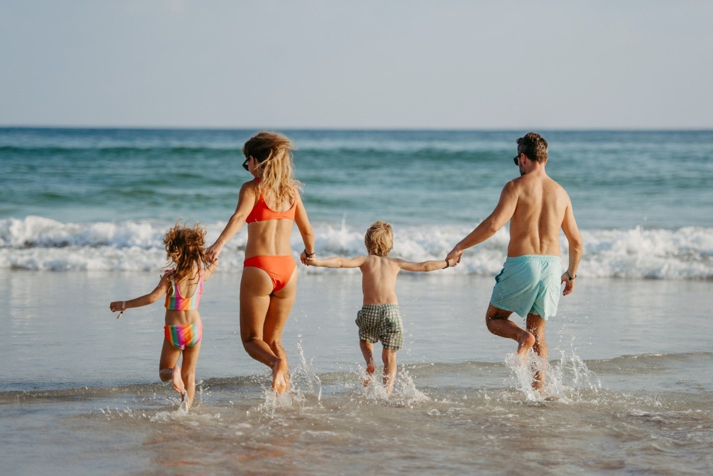 Using insect repellent to get rid of biting flies at the beach