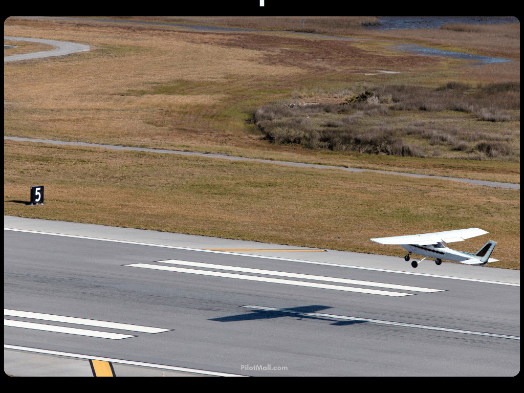 Small Airplane Landing on Runway