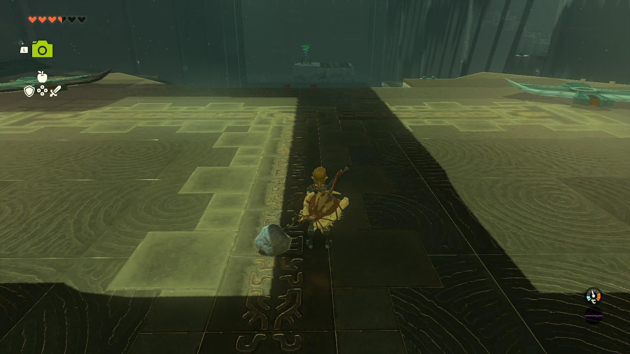 Link observing two wings at the start of the Jirutagumac Shrine, preparing for the flying device challenge in Zelda Tears of the Kingdom.