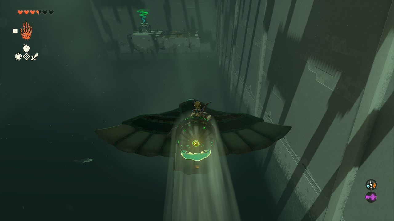Link riding a fan-powered wing across a chasm in the Jirutagumac Shrine, successfully piloting a flying device in Zelda Tears of the Kingdom.
