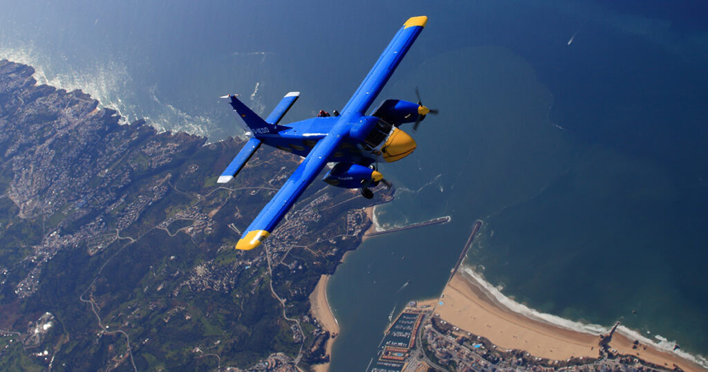 Dornier aircraft flying over the coast.