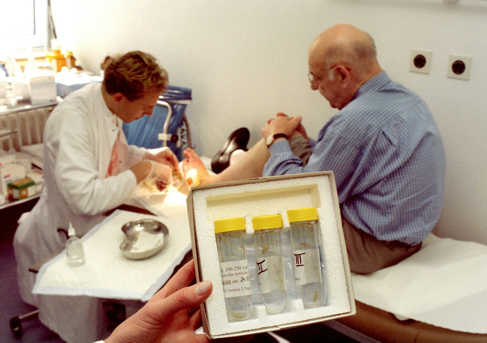 A doctor working on patient