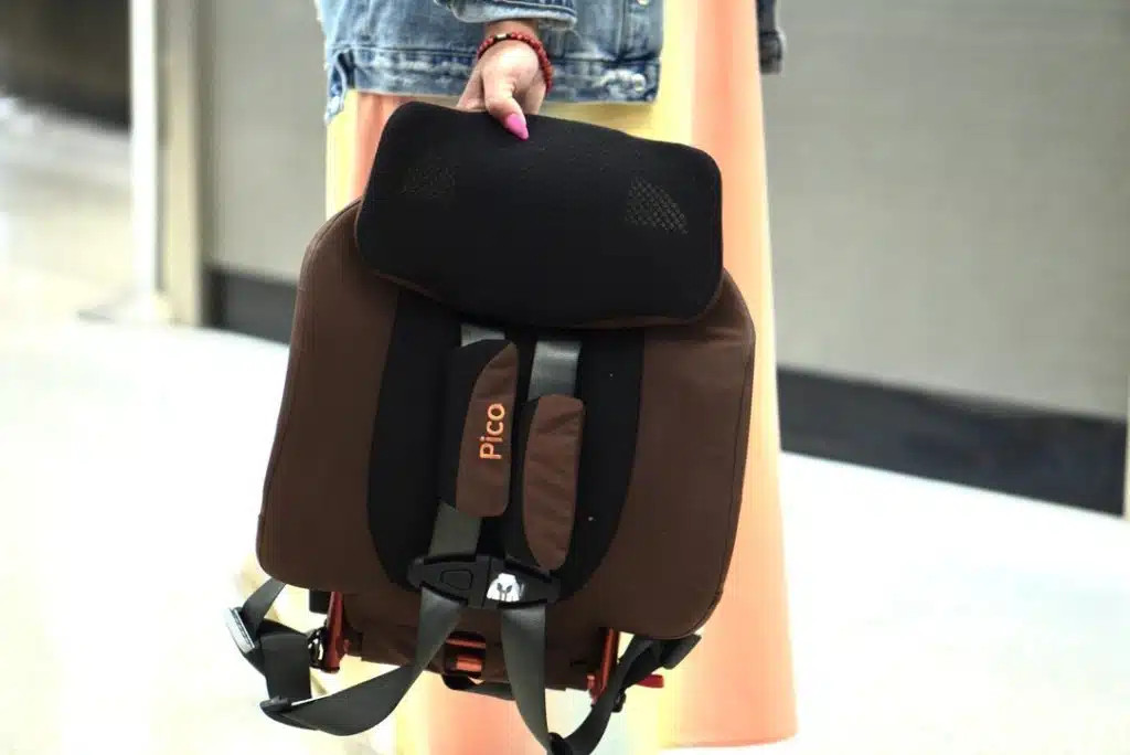 Mother and toddler smiling at the airport