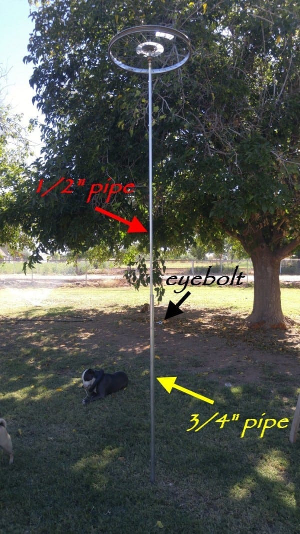 Sliding the conduit pipe with the wheel into the support pole