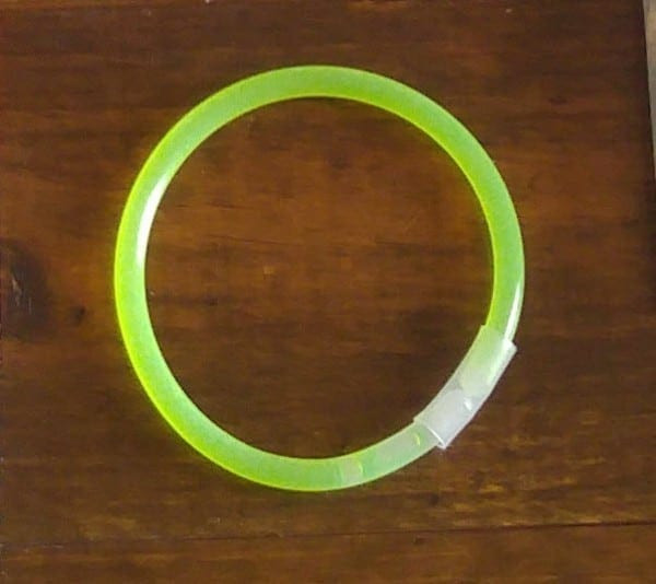 Inserting a glow bracelet into the ghost's head