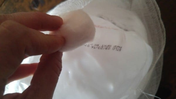 Removing the stamped date from the milk jug