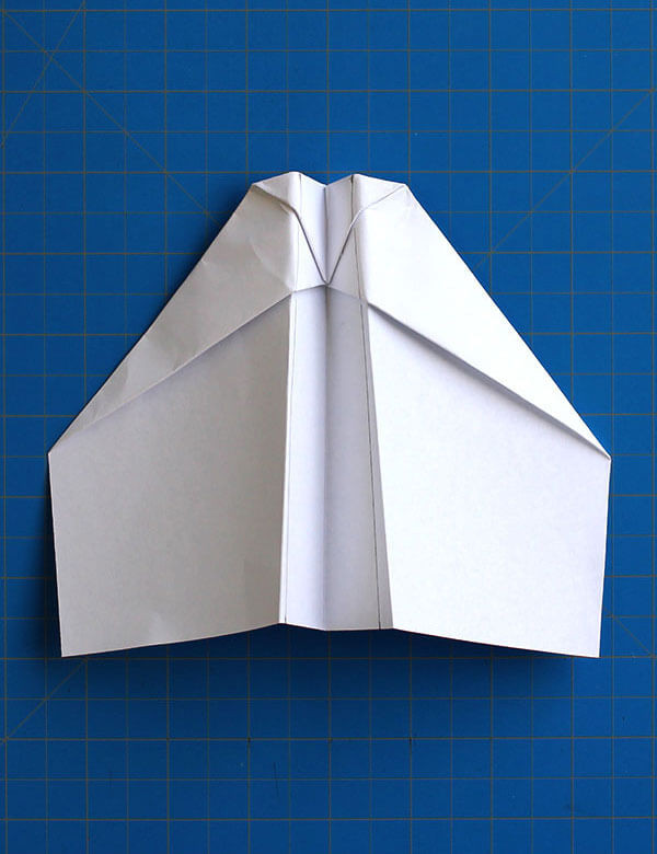 Step 11: Folding along measured lines to create flaps for flight direction control