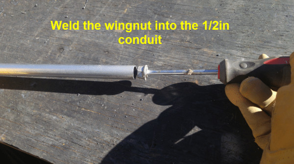 Welding the wing nut into the conduit pipe