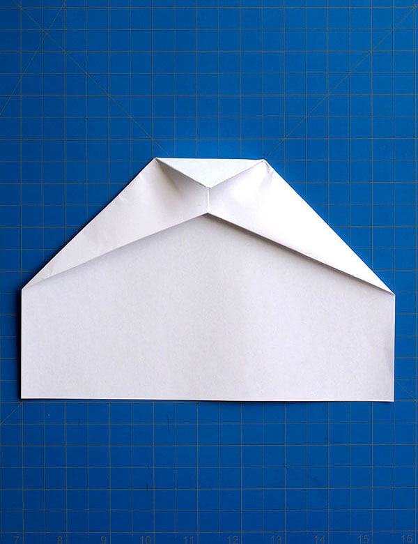 Step 9: Folding the nose down to create an aerodynamic shape, reducing air resistance