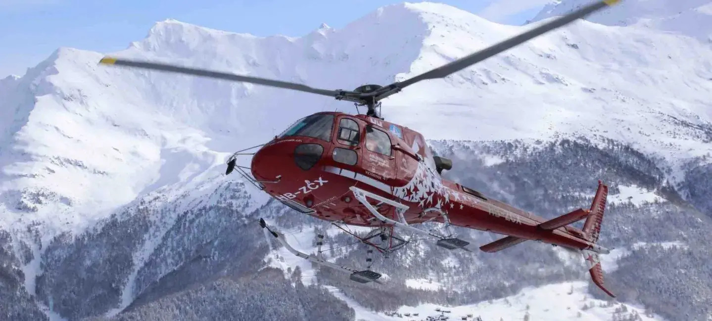 Eurocopter AS350 B2 helicopter flying in the mountains