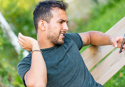 Black fly bites on a person's neck causing inflammation and irritation