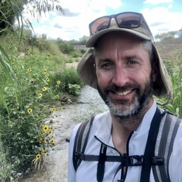 Michael Bogan, whose research focuses on how drought and water use shape stream habitats and their biodiversity in the arid Southwest