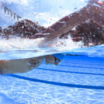 Swimmer demonstrating proper butterfly recovery technique