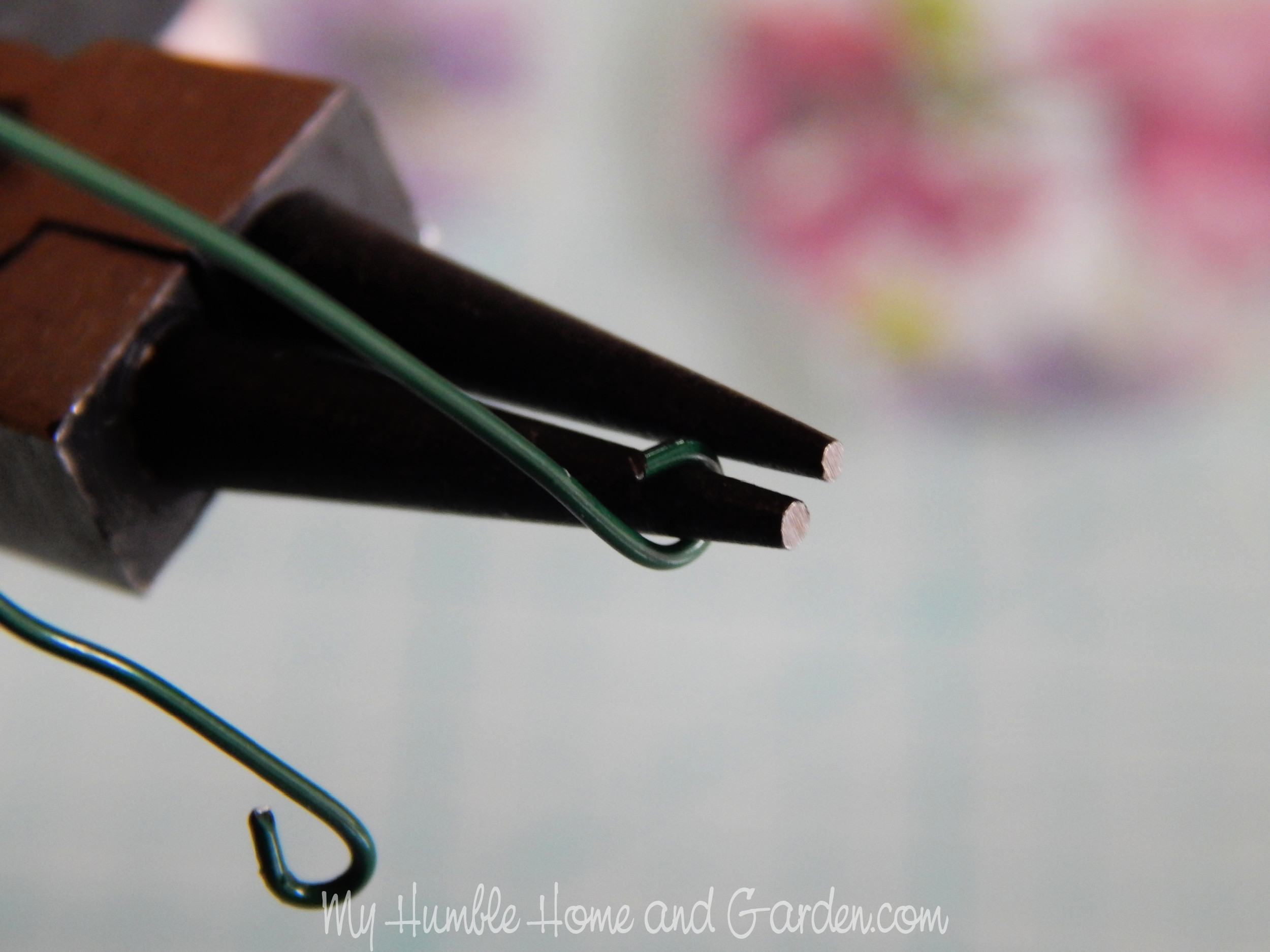 Close-up of wire being curled to ensure safety.