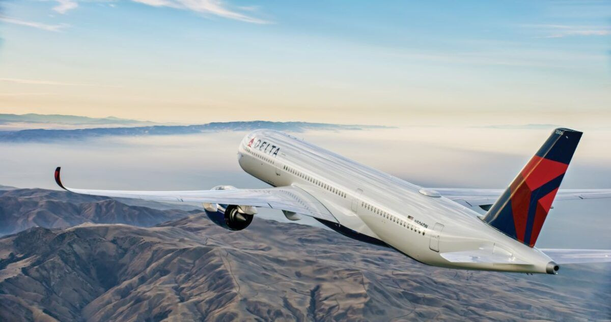 Delta Air Lines plane flying over mountains