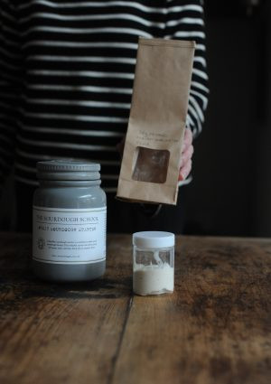 Vanessa sharing sourdough starter