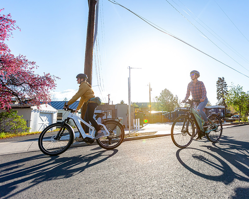 People riding e-bikes around Bend, Oregon, highlighting the city's active and outdoor lifestyle