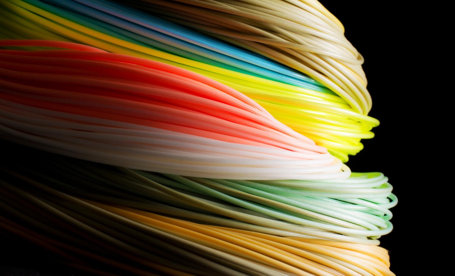 Louis Cahill's vibrant fly fishing image showcasing various colored fly lines and emphasizing the debate on whether color spooks fish.