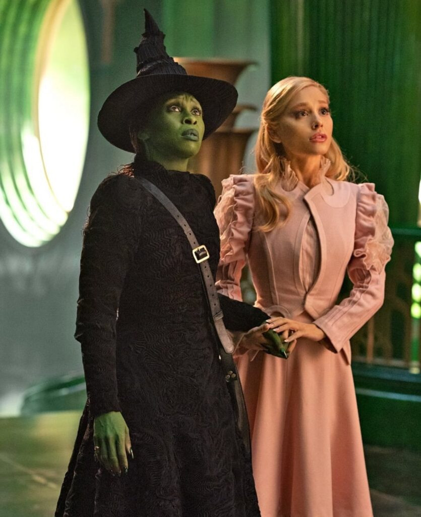 Elphaba and Glinda in a scene from Wicked, showcasing their complex relationship