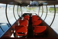 Blimp gondola showcasing pilot seats and passenger seating