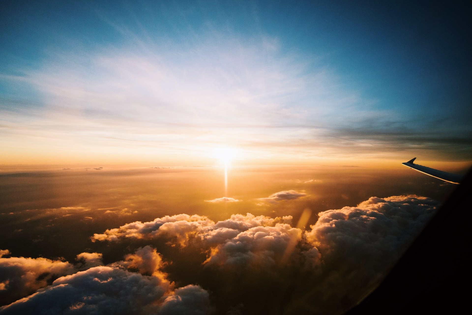 A commercial jet aircraft flying through a layer of Earth