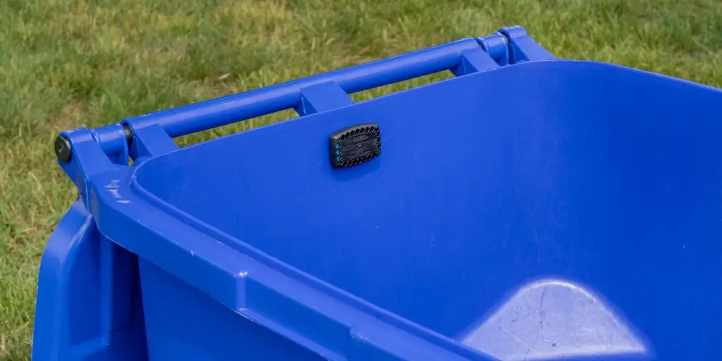A garbage guard on a blue bin