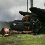 Hiccup and Toothless soaring through the clouds
