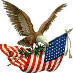 American flag waving in the wind against a clear blue sky