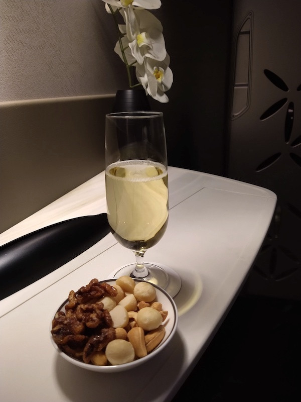 Take off champagne, a hot towel and warm nuts
