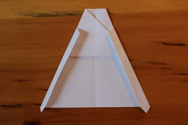 With both sides of wings folded in.
